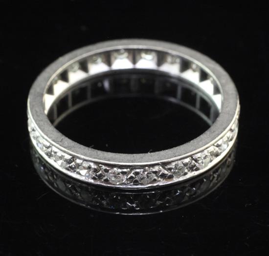 A platinum and diamond full eternity ring, size Q.